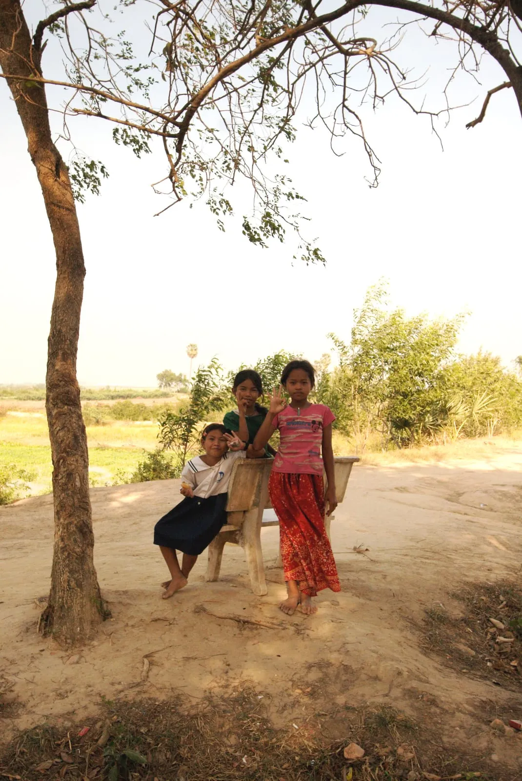 "1-2-3 SMILE!" Girls at the Killing Fields