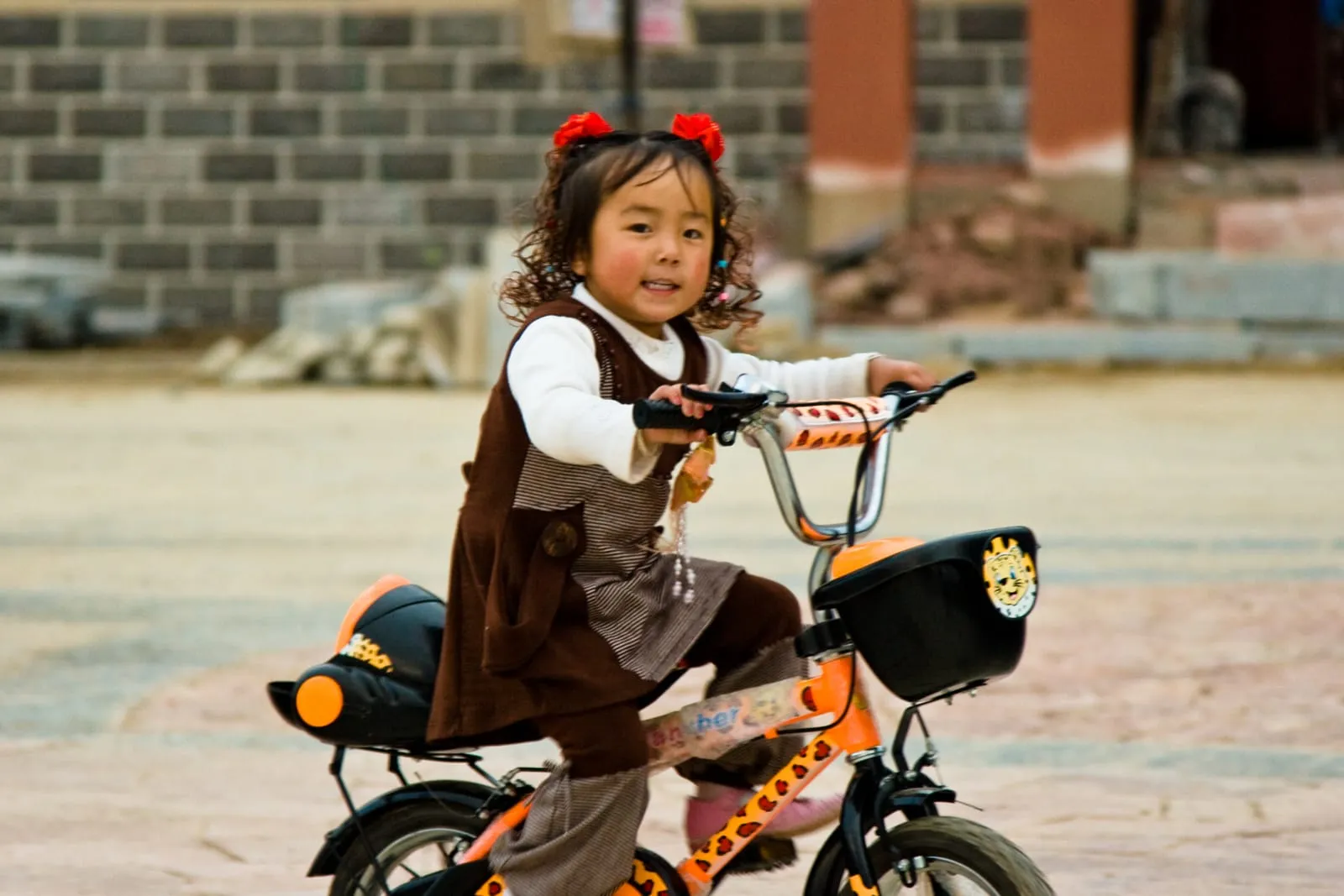 Girl cycling near Tibet